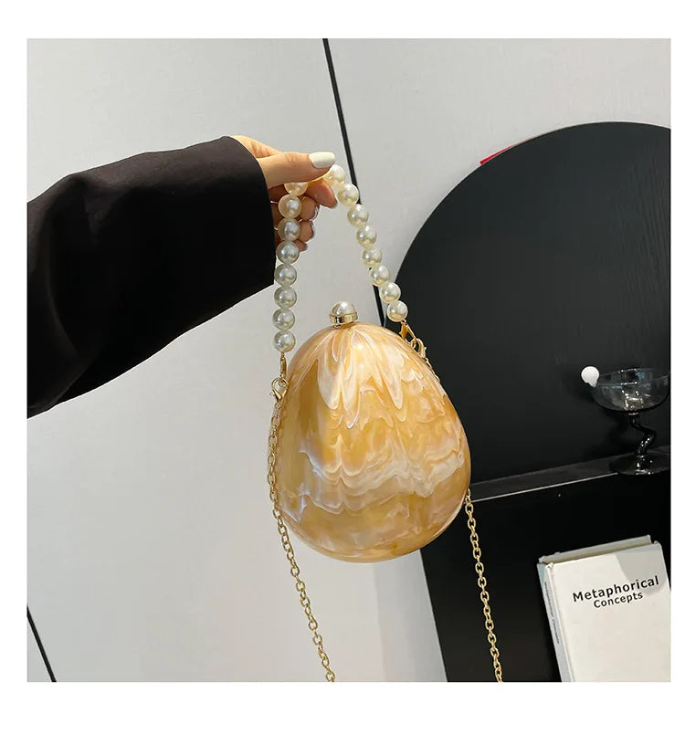New acrylic eggshell bag 2025 fashion niche design women's messenger bag portable dinner bag